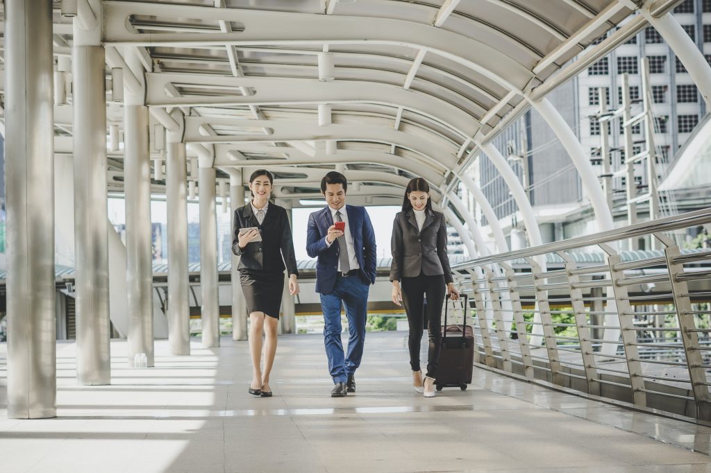 Business man and woman are going on business trip.